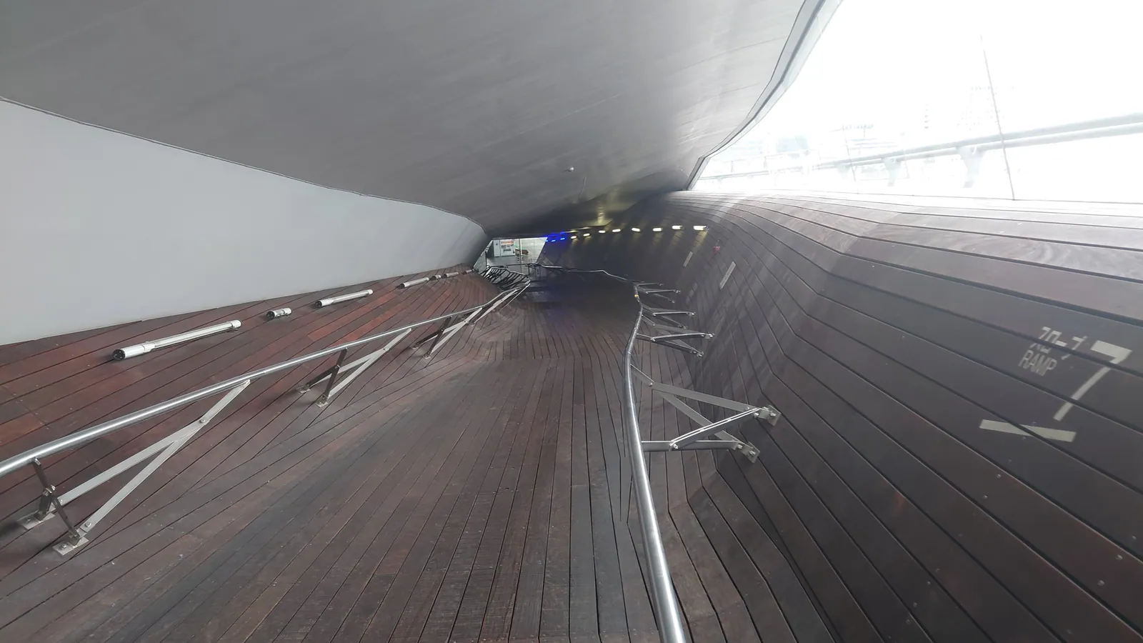 A wooden pedestrian ramp with handrails at Osanbashi Yokohama International Passenger Terminal