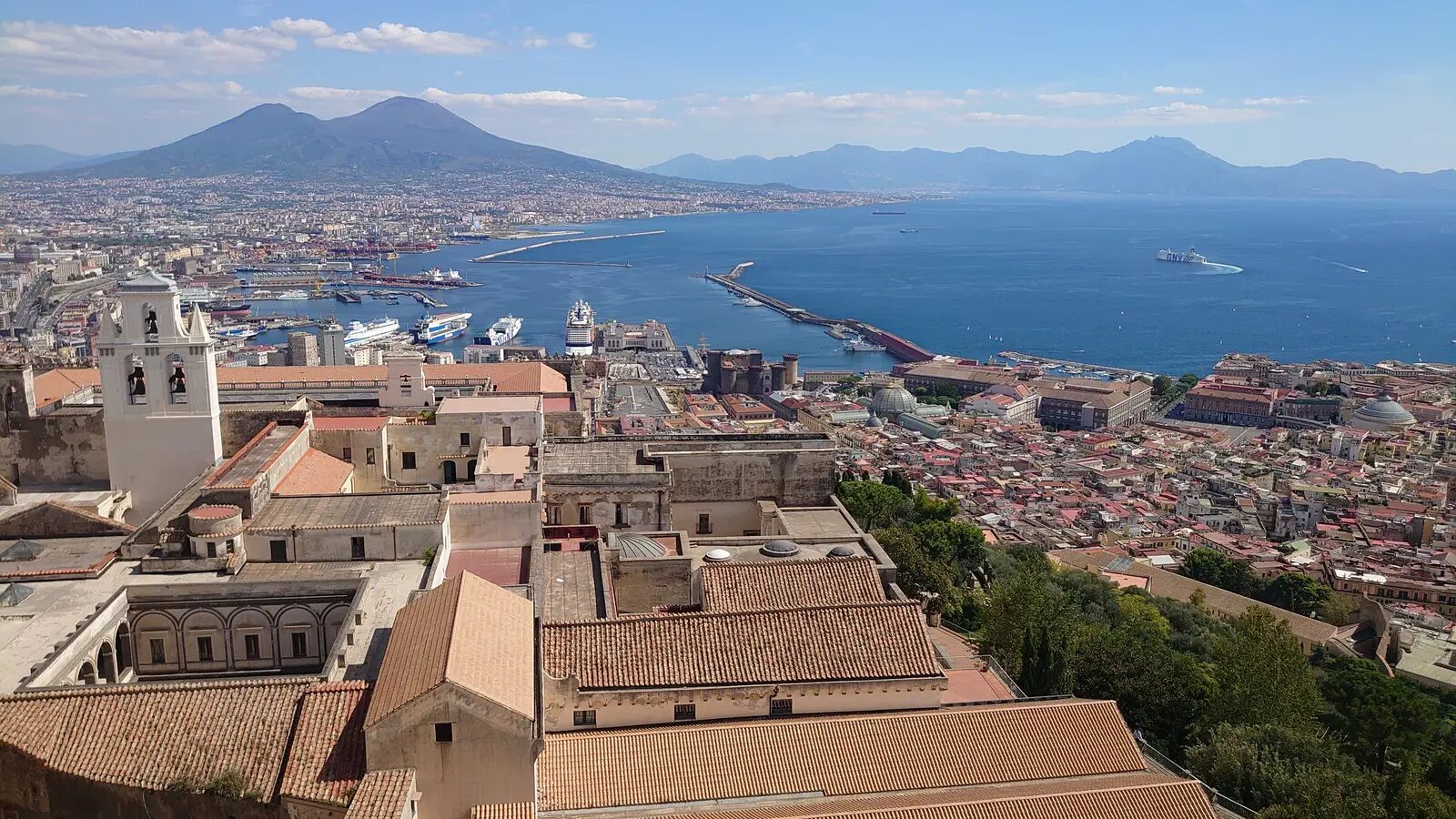 Maschio Angioino and waterfront cityscape in Naples, Italy