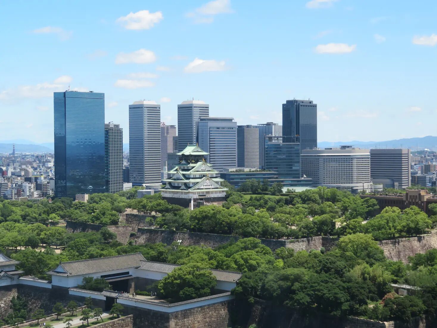 Osaka Castle and the Osaka city skyline in Japan