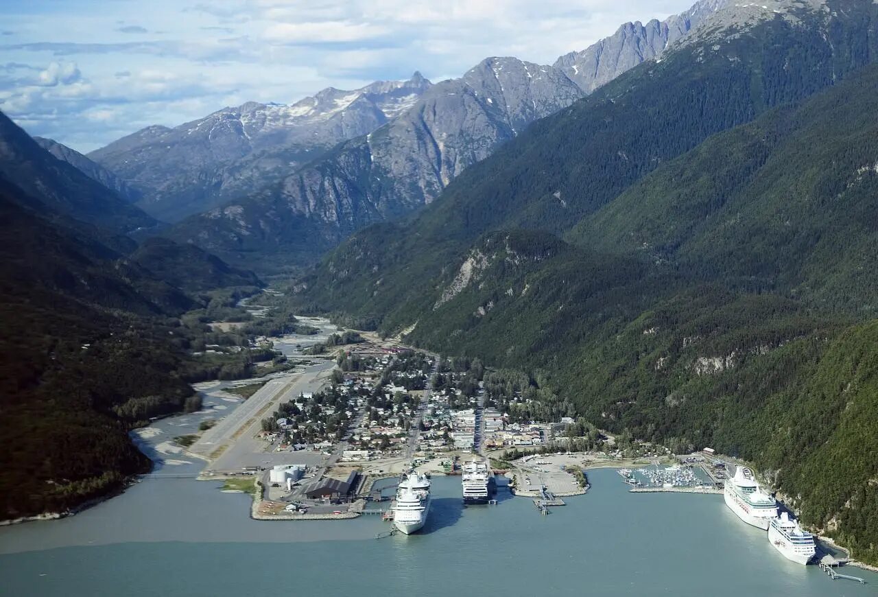 Aerial view of Skagway between mountains and water in Alaska